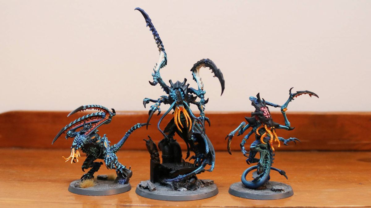 New Tyranid Deathleaper alongside other models on a wooden table