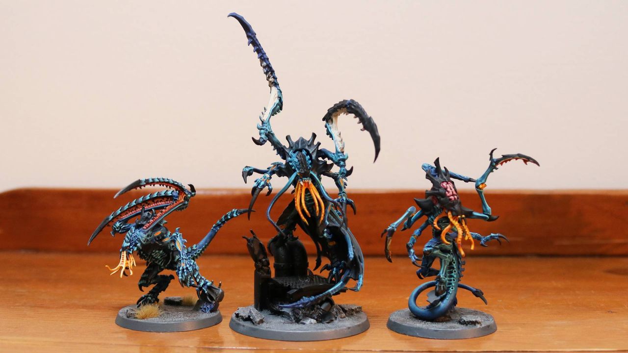 New Tyranid Deathleaper alongside other models on a wooden table