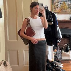 Laura Reilley wearing a white tank top.