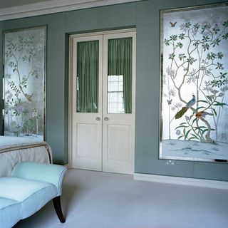 bedroom with hand printed wall and silvery fabric panels