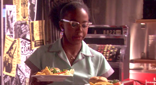 Jerrika Hinton serves up some burgers as a waitress on Gossip Girl