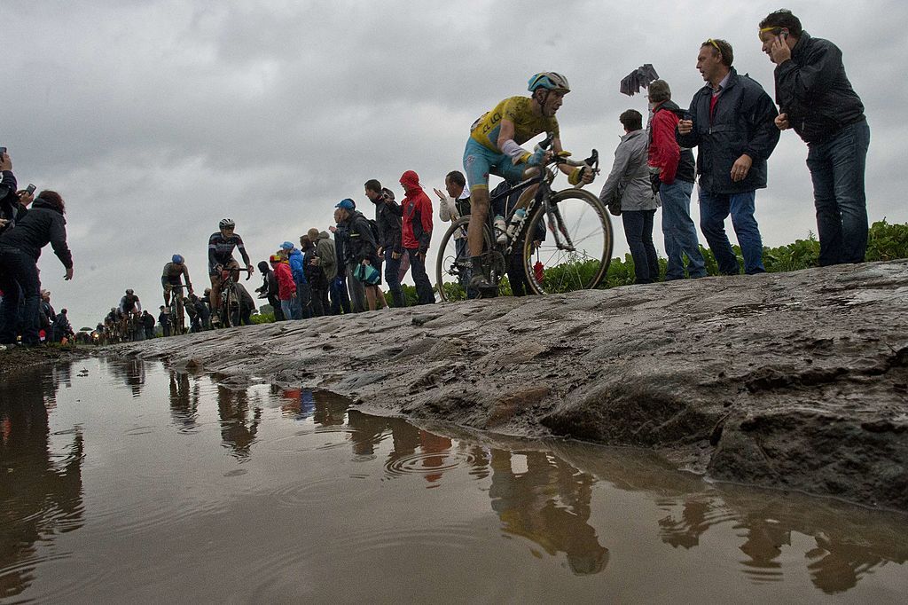 Italys Vincenzo Nibali wearing the overall leaders yellow jersey during the 1525 km fifth stage of the 101st edition of the Tour de France cycling race on July 9 2014 between Ypres northwestern Belgium and Arenberg Porte du Hainaut in Wallers northern France AFP PHOTO JEFF PACHOUD Photo credit should read JEFF PACHOUDAFP via Getty Images