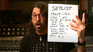 AI Dave Grohl holding up a 'setlist' of gibberish with 6 fingers