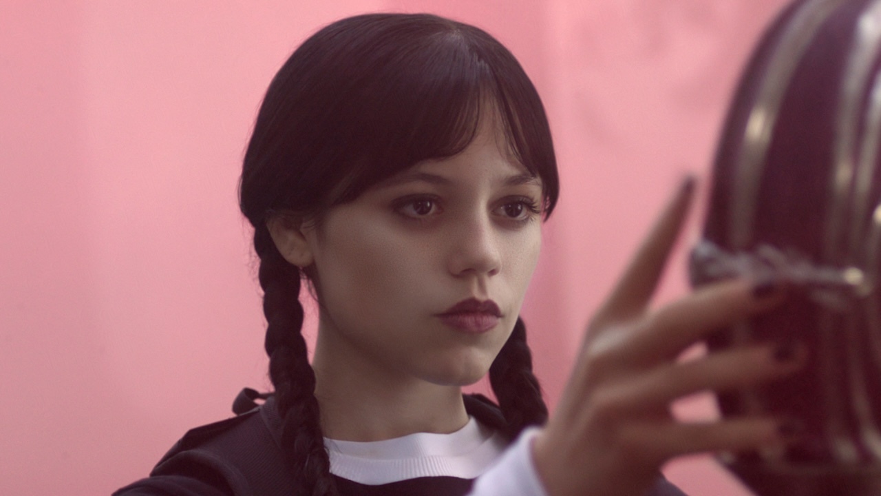Jenna Ortega as Wednesday Addams in Netflix&#039;s Wednesday Episode 203 looking coldly at someone.