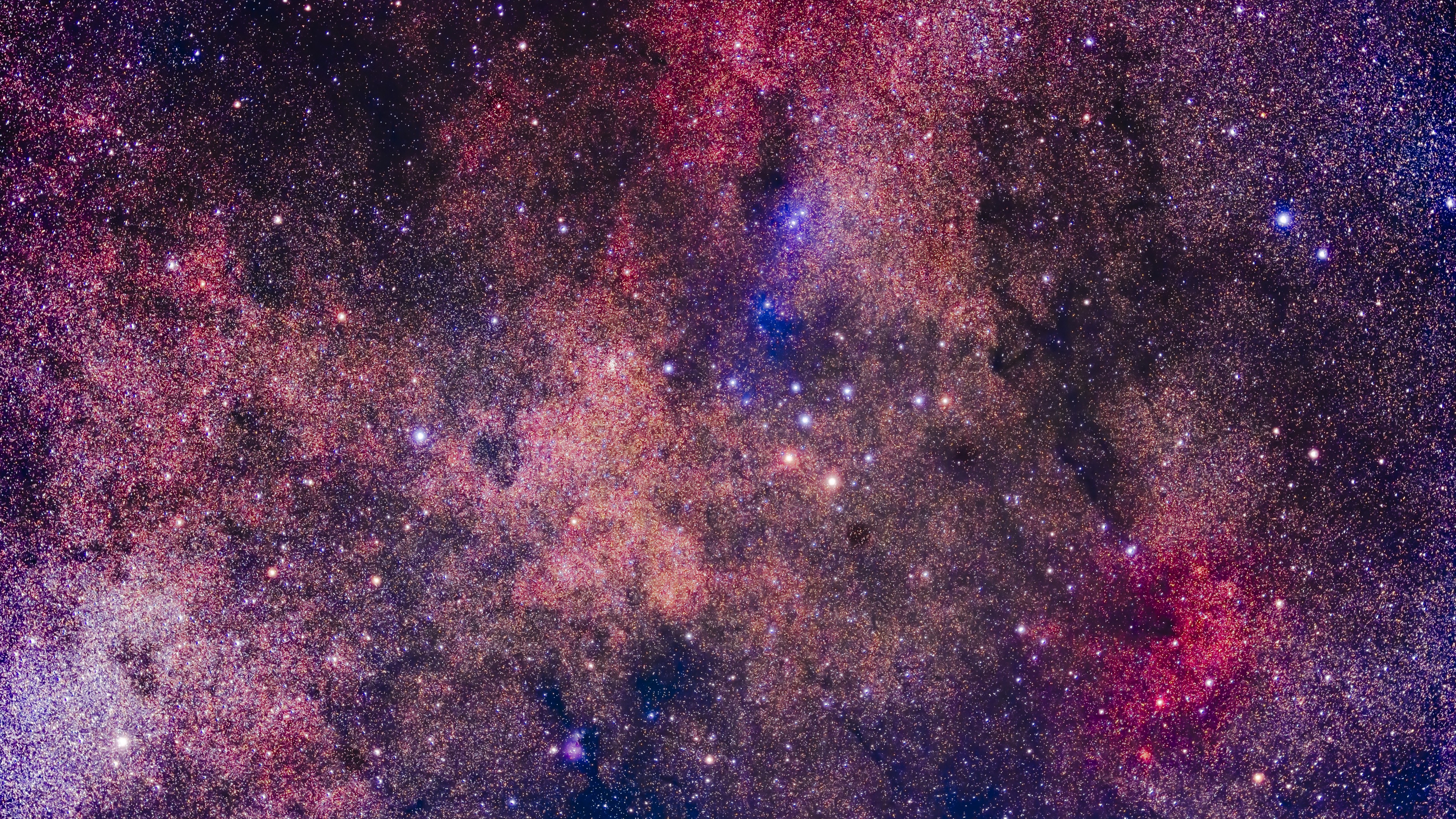 deep space image showing vast amount of colourful stars and rich nebula structures.