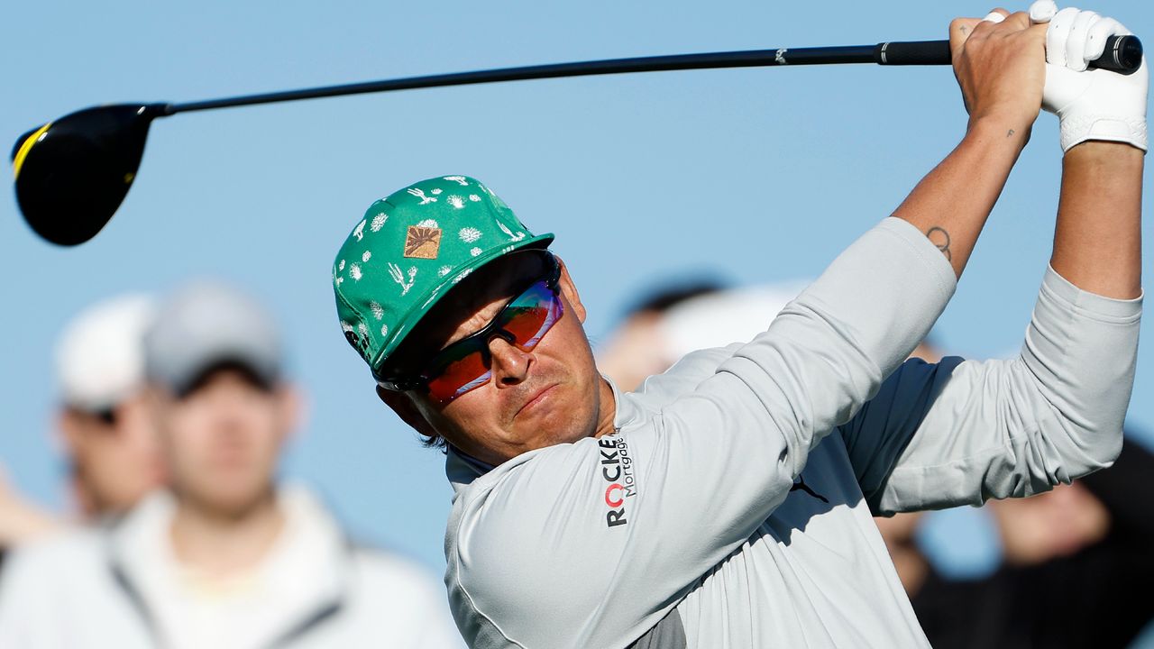 Rickie Fowler hits his tee shot on the 15th hole during the 2022 WM Phoenix Open