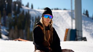 An official lifestyle image of a person wearing Oakley Meta Vanguard smart glasses