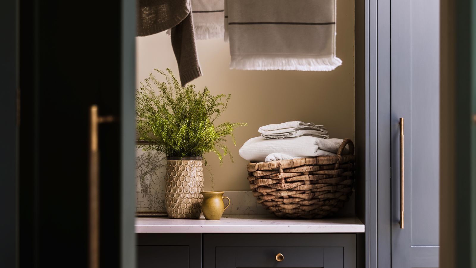 The smartest ways to hide laundry in your utility room