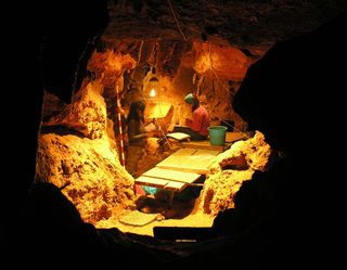 Researchers working inside the El Sidrón cave in Spain where the skeleton of a Neanderthal boy was found.
