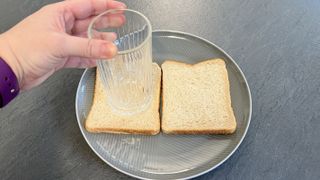 Pressing glass into bread