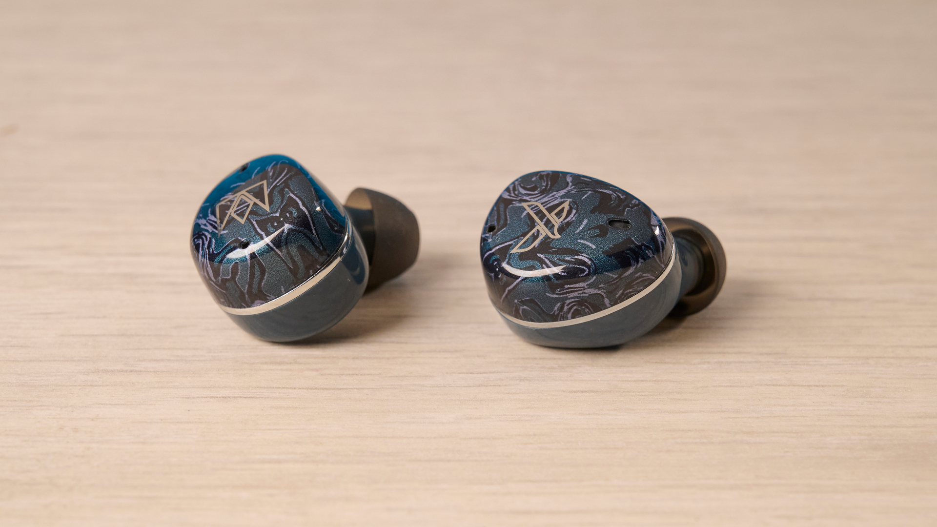 A pair of Noble Audio Osprey wireless earbuds