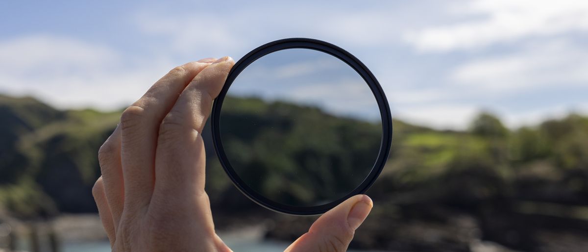 The Kenko Pro1D+ circular polarizing filter held up to the sun