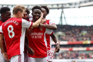 Bukayo Saka of Arsenal celebrates scoring their 2nd goal from the penalty spot during the Premier League match between Arsenal and Manchester United at Emirates Stadium on April 23, 2022 in London, United Kingdom.