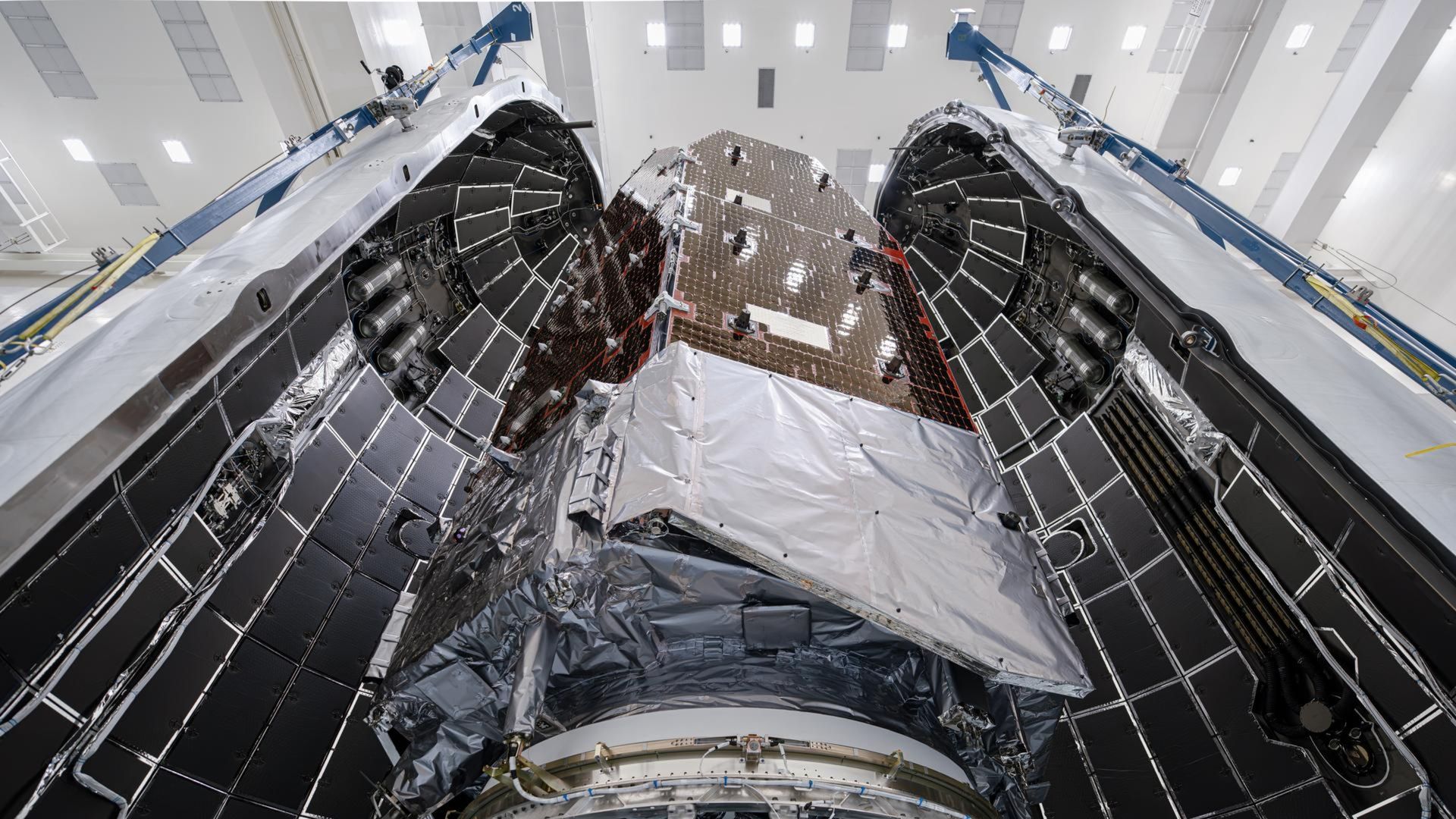 A photo of the telescope being loaded into its protective casing
