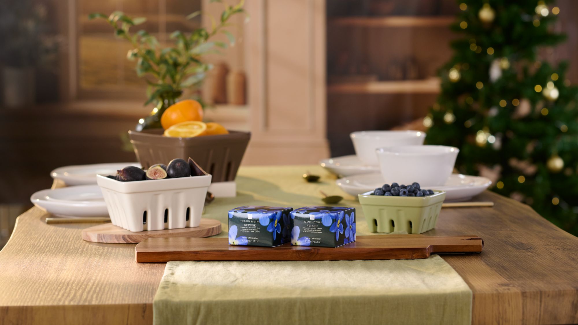 TEMPLESPA REPOSE moisturiser boxes on. a wooden table