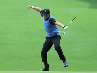 Graham DeLaet celebrates holing a crucial chip in the 2013 Presidents Cup