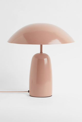 Blush toned metal table lamp with modern design from H&M Home.