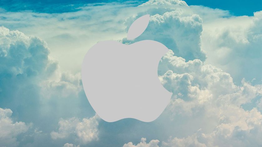 The Apple logo on a background of clouds in a blue sky
