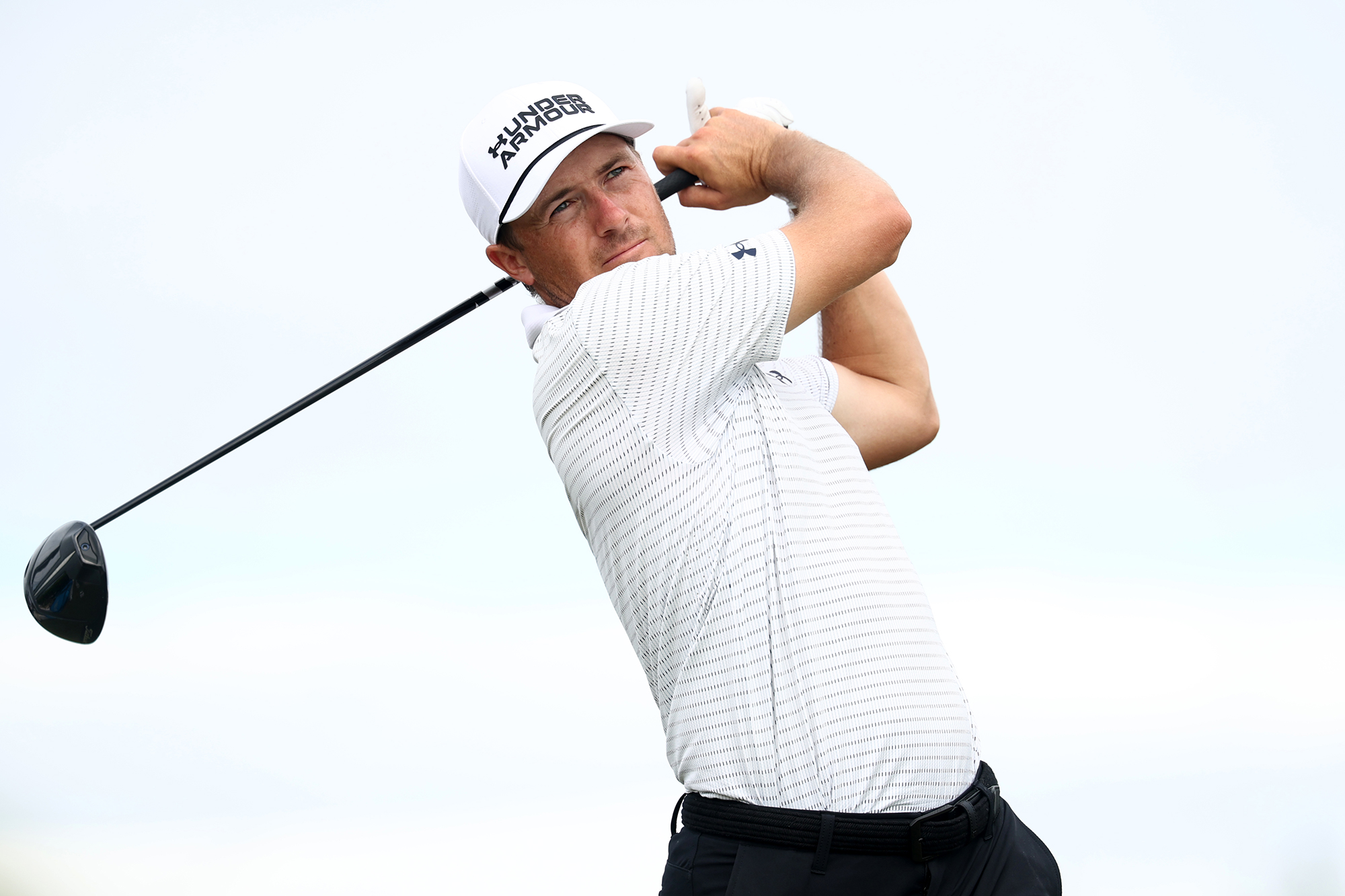 Jordan Spieth in the finish position with driver after hitting a tee shot