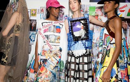 Models dressed in Mary Katrantzou waiting S/S 2019 collections at the back stage london fashion week