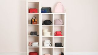 Handbags on bookshelf