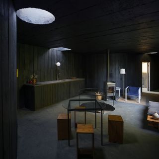 dark and moody concrete interior with skylights