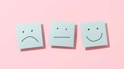 Three Blue Sticky Blank Notes On Pink Background