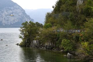 BERGAMO ITALY OCTOBER 09 A general view of the Peloton passing through Lake Como area during the 115th Il Lombardia 2021 a 239km race from Como to Bergamo ilombardia UCIWT on October 09 2021 in Bergamo Italy Photo by Tim de WaeleGetty Images