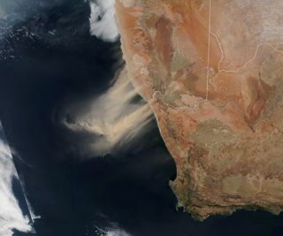 The Suomi-NPP weather satellite captured this view of an enormous dust storm in southern Africa on Sept. 25, 2019. Coastal towns watched as the sky turned red from the thick plumes of dust and sand that rose into the air, and strong winds pushed those winds offshore into the Atlantic Ocean. Suomi NPP, which is operated jointly by NASA and the National Oceanic and Atmospheric Administration (NOAA), watched the dust storm in action when it flew over the scene at 2:25 p.m. local time (1225 GMT). Areas affected by the storm were located north and south of the Orange River, which forms part of the border between Namibia and South Africa, NASA officials said in a statement.