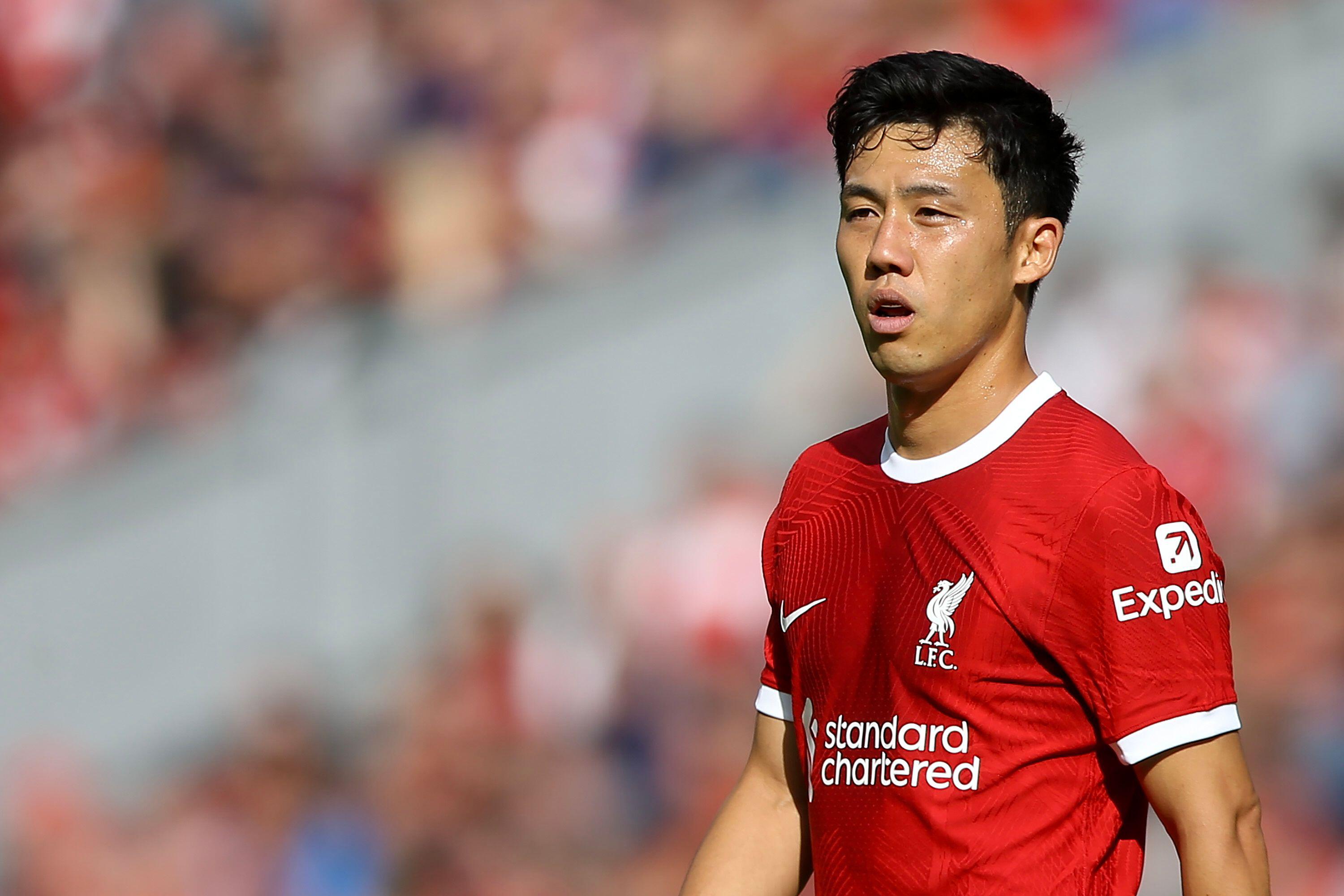 Wataru Endo looks on while playing for Liverpool against Bournemouth, 2023