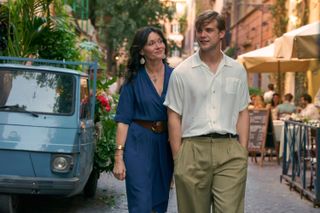 Dexter and Alison walk through the streets of Rome.