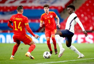 Saka, right, played 76 minutes at Wembley