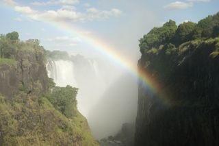 A rainbow across Victoria Falls.