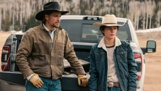 From left to right: Kayce and Tate sitting behind a truck in Marshals. 