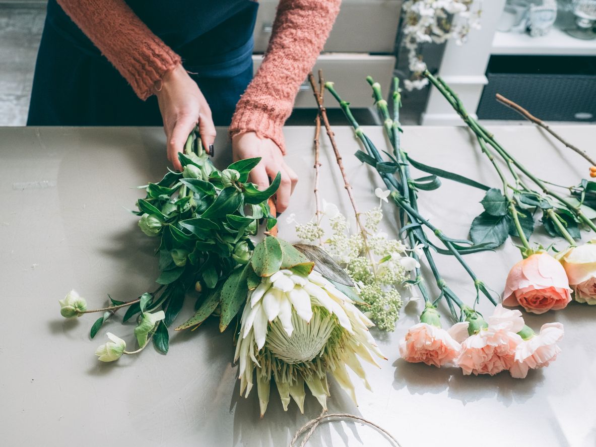 Florist arranging a bouquet. 