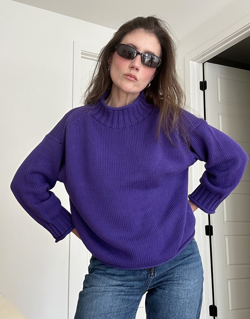 Allyson Payer wearing the J.Crew 2025 Rollneck Sweater in Tetra Purple.