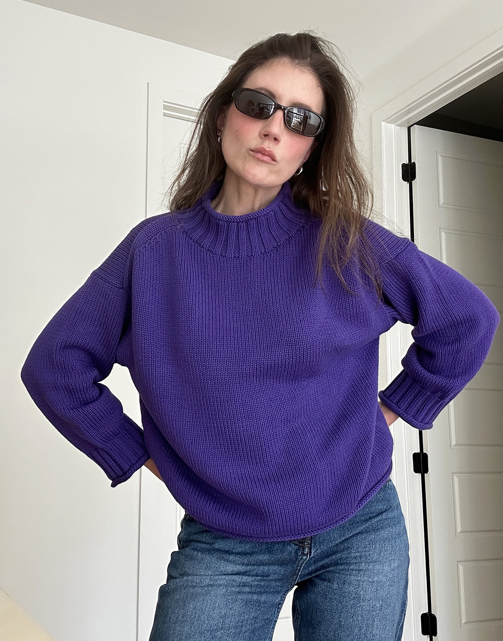 Allyson Payer wearing the J.Crew 2025 Rollneck Sweater in Tetra Purple.