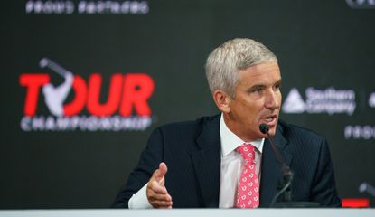 Monahan talks in front of the Tour Championship logo