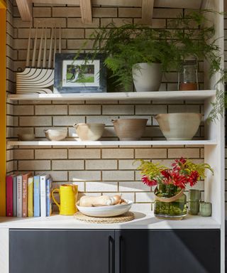 Architect George Woodrow’s extended kitchen impresses with bespoke joinery and jaunty yellow accents, and it’s the perfect sociable space for his young family