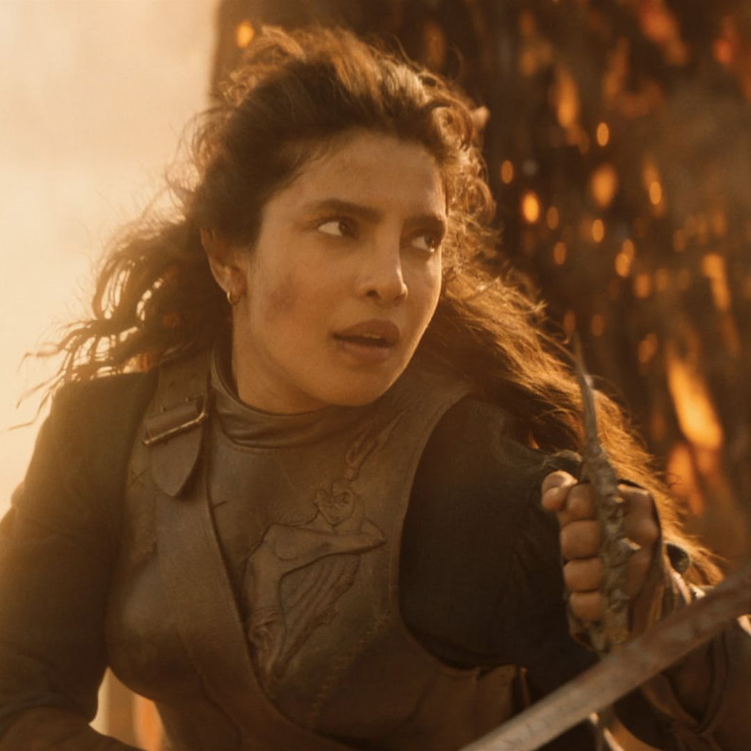 priyanka copra as a pirate in armor fighting on a ship engulfed in flames in a still from the 2026 action movie the bluff