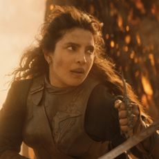 priyanka copra as a pirate in armor fighting on a ship engulfed in flames in a still from the 2026 action movie the bluff