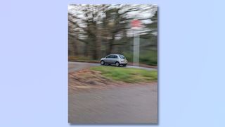 Screenshot showing steps to taking action Pan photos on a Google Pixel phone - photo of car taken with Action Pan