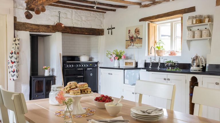 traditional white kitchen ideas: pullen campbell white kitchen farmhouse table beams