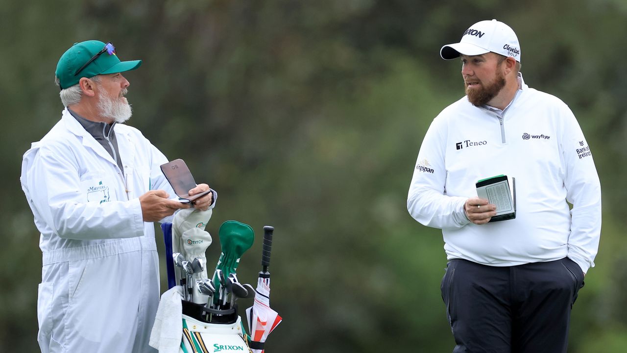 Shane Lowry and his caddie pictured