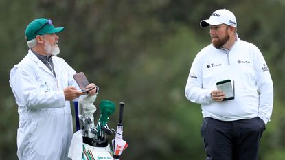 Shane Lowry and his caddie pictured