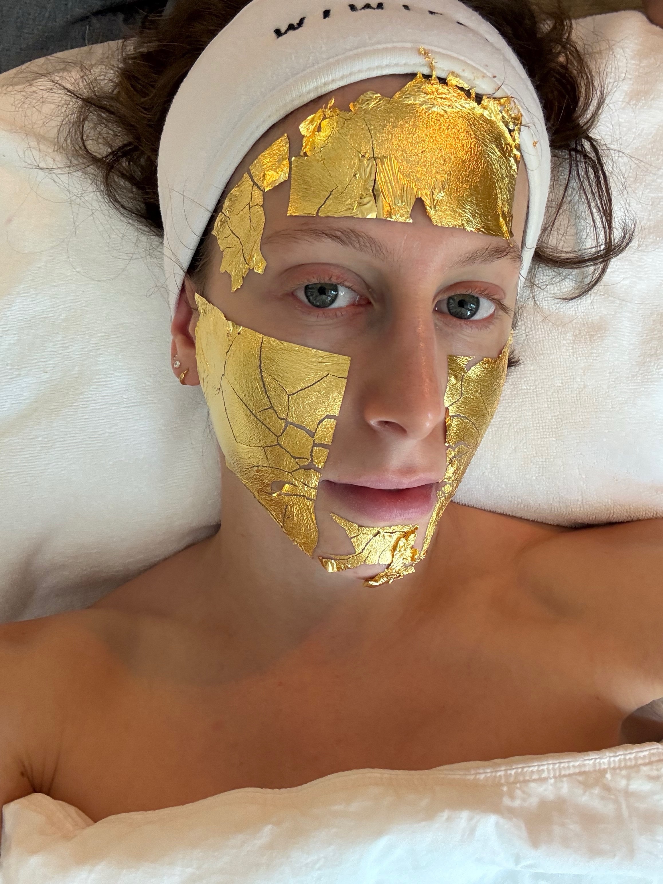 Photo of Jamie Schneider receiving a Mimi Luzon facial