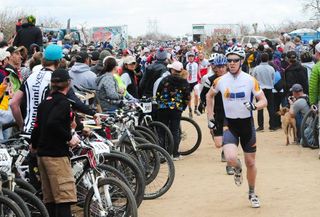 Hundreds of racers run to their bikes in the Le Mans start at the 24 hours of Old Pueblo.