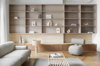 A living room with symmetrical shelving