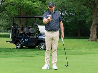 Europe's senior AimPoint instructor, Jamie Donaldson, reading a putt on the green