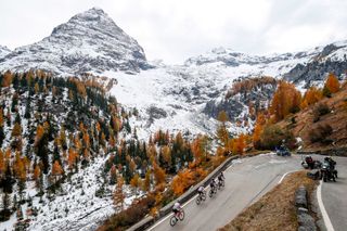 Cyclists ride uphill at the Passo dello Stelvio Stelvio Pass during the 18th stage of the Giro dItalia 2020 cycling race a 207kilometer route between Pinzolo and Laghi di Cancano on October 22 2020 Photo by Luca Bettini AFP Photo by LUCA BETTINIAFP via Getty Images